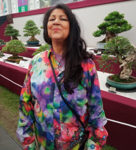 p17 LEAD Inset 2 Chila Burman at Chelsea. Chila with bonsai 26 May 2024